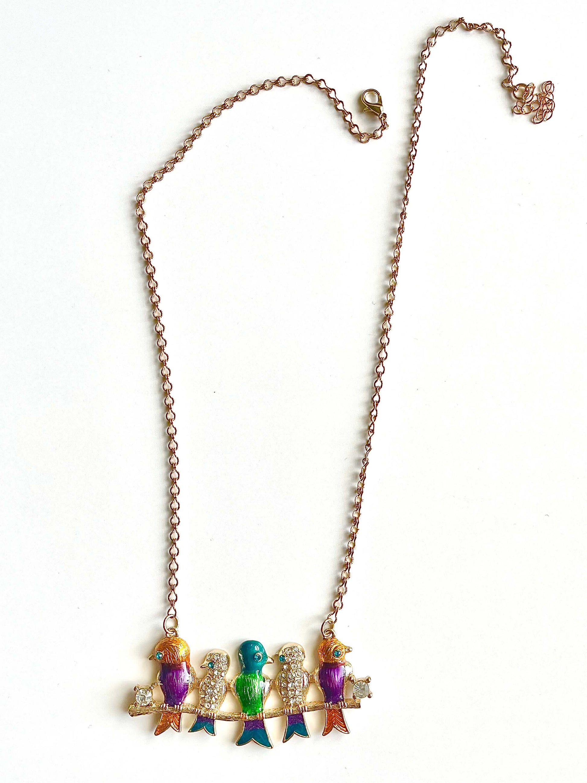 Necklace with colorful pendant on a white background