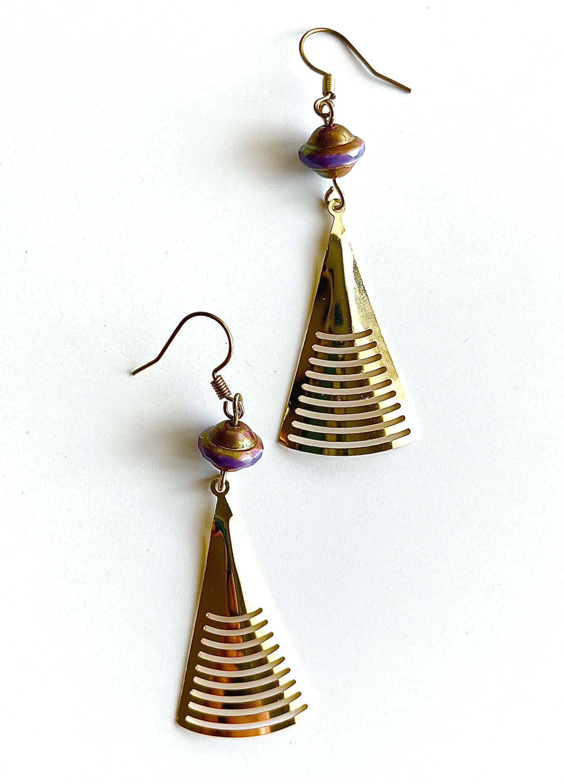 Yellow brass earrings with purple and gold Saturn Beads and hanging triangle pendant