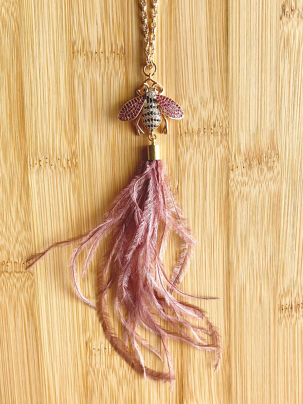 Mauve ostrich feather and crystal bee pendant necklace