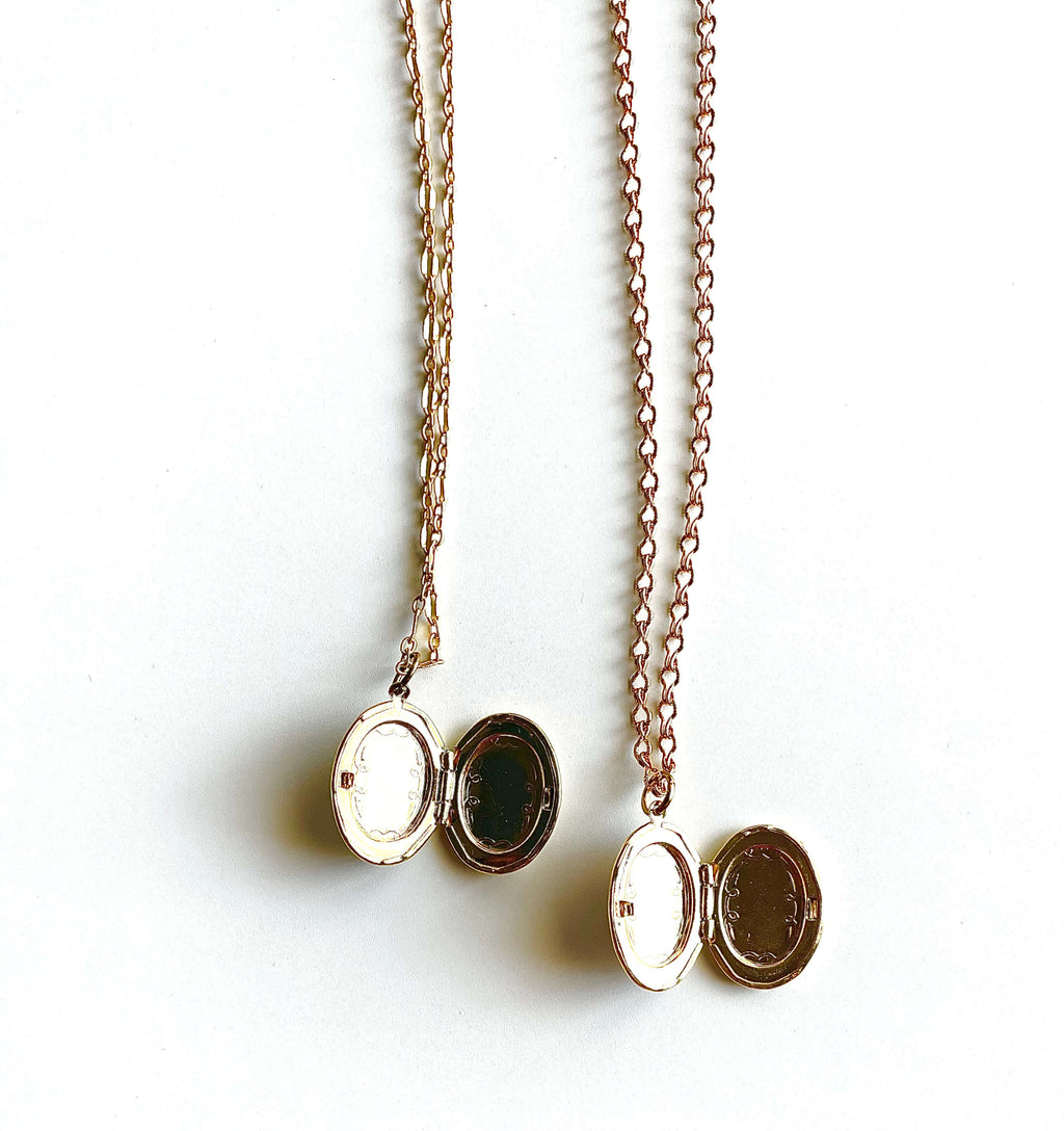 Yellow brass open lockets on white background