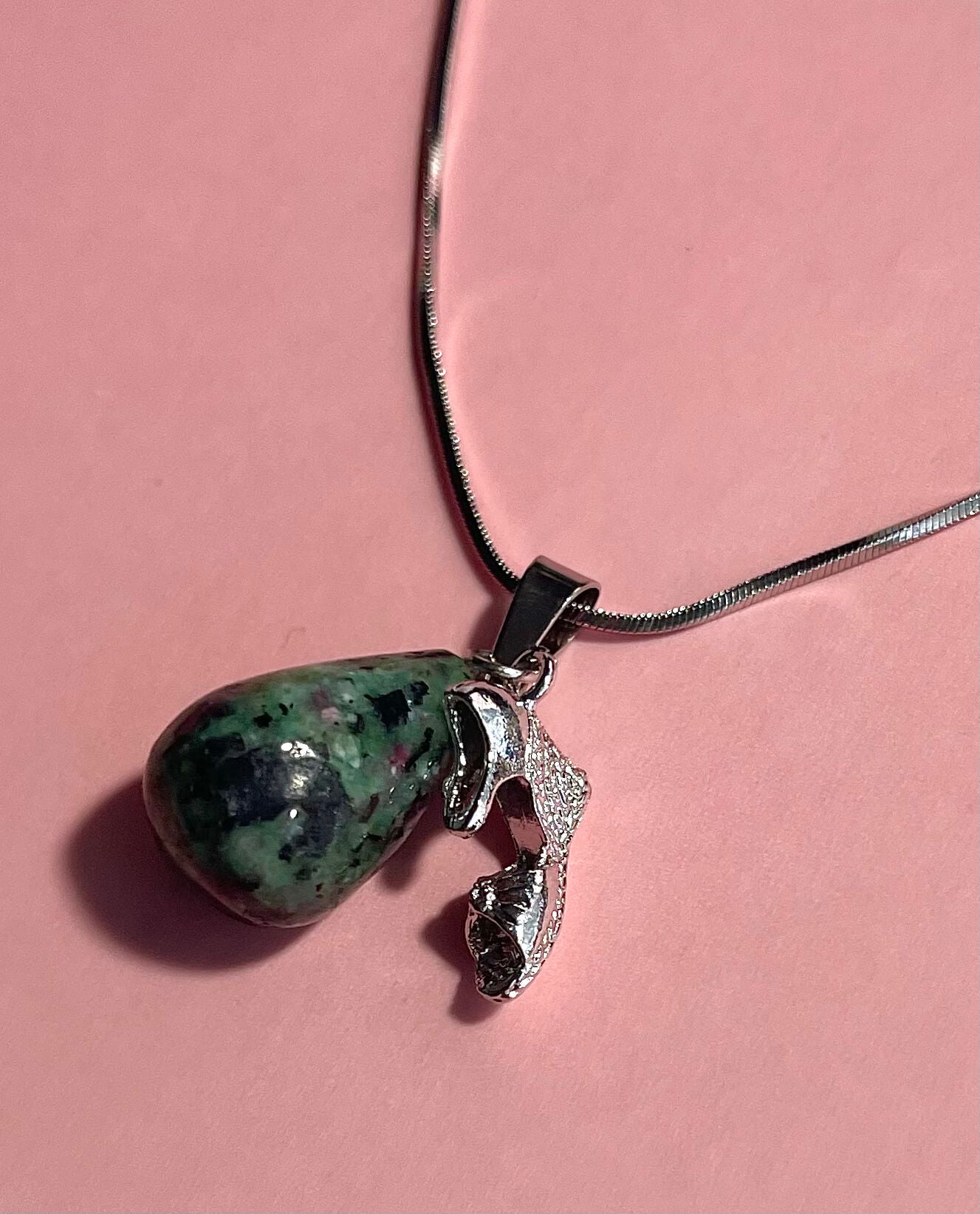 Silver necklace with zoisite teardrop pendant and shoe charm with pink background