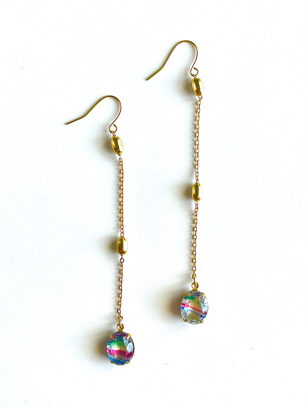 Gold chain earrings with colorful beads on a white background